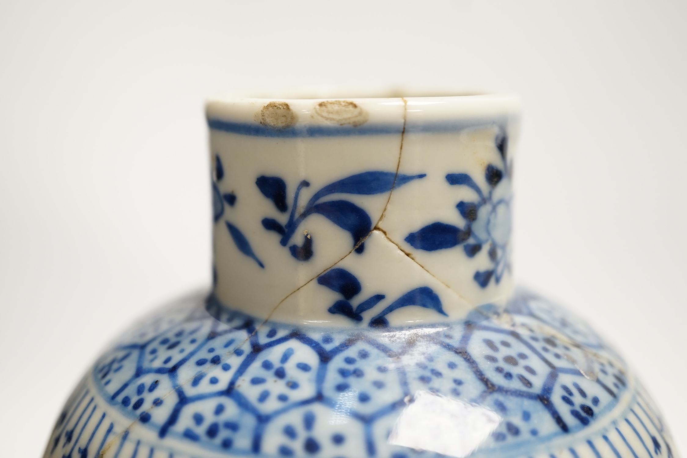 Two early 20th century Chinese blue and white vases, one restored, 23cm